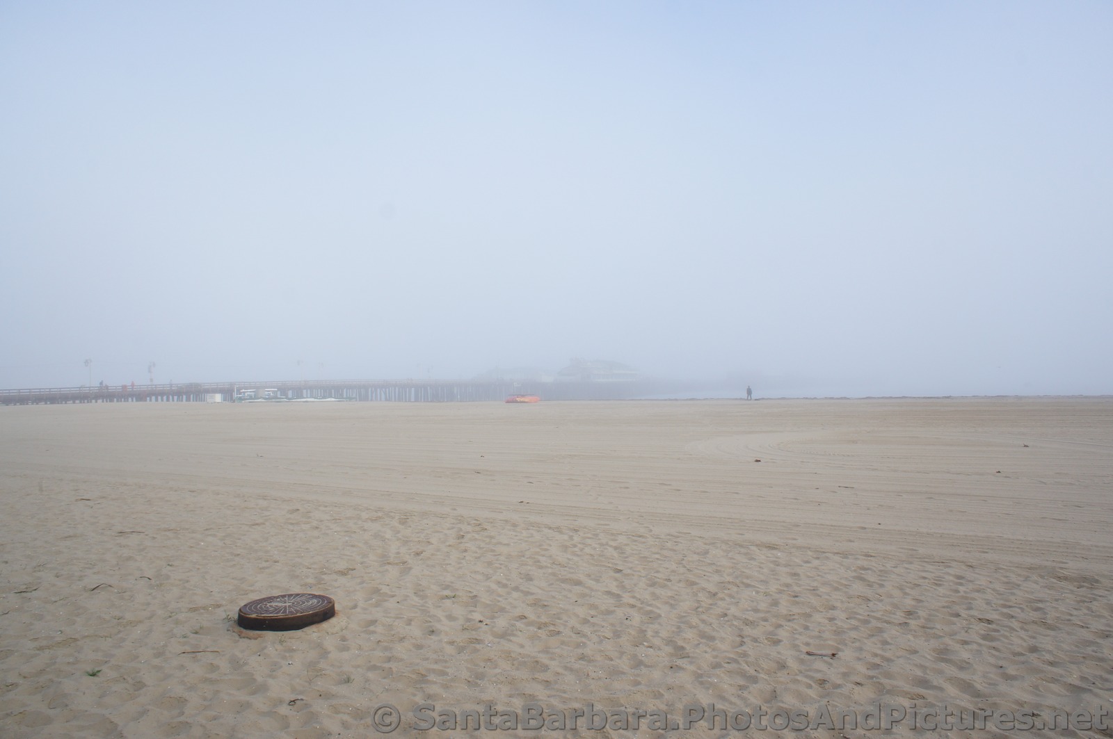 Stearns Wharf on a foggy day seen from West Beach.jpg