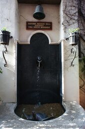 Historic Mission Bell above fountain at La Arcada Santa Barbara.jpg